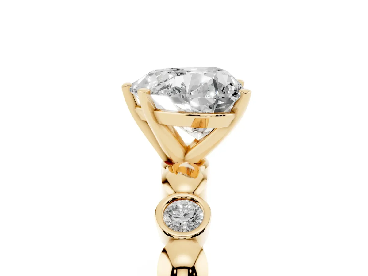 Heart Cut Solitaire Bezel-Set Diamond Ring with Beaded Band and Four-Prong Setting Yellow gold