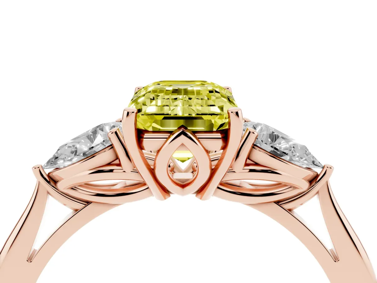 Fancy Yellow Three-Stone Emerald Cut Diamond Ring with Pear Side Stones in Four-Prong Setting Rose gold