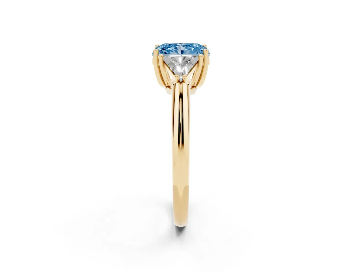Fancy Blue Three-Stone Radiant Cut Diamond Engagement Ring with Trillion Side Stones and Prong Setting Yellow gold