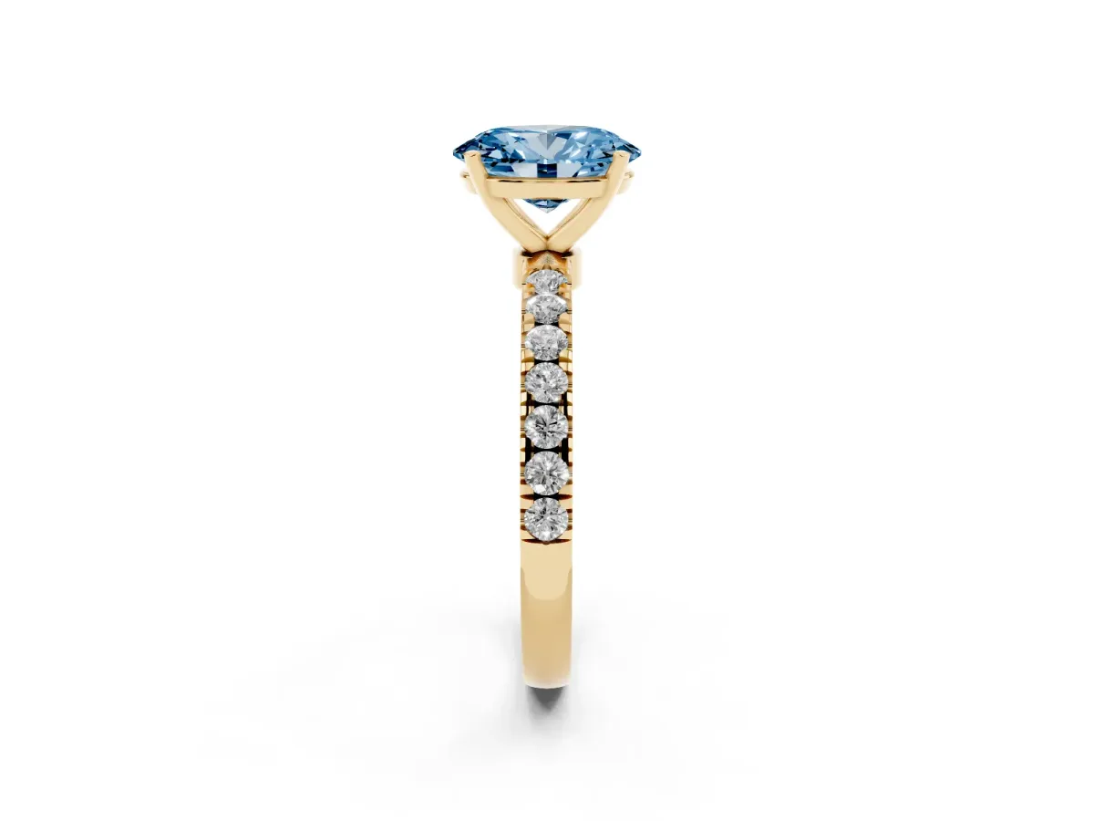 Fancy Blue Oval Cut Diamond Solitaire Ring with Pavé Accents and Four-Prong Setting Yellow gold