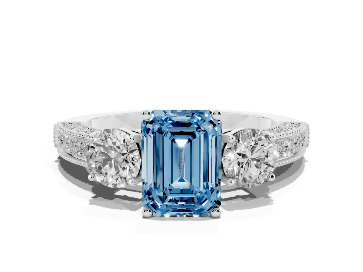 Fancy Blue Emerald Cut Three-Stone Diamond Ring with Pavé Band and Four-Prong Setting Silver