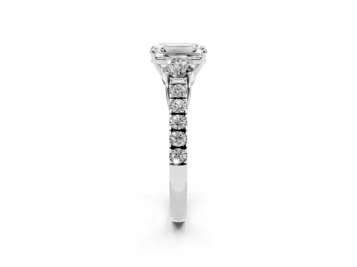Emerald Cut Cut Diamond Three-Stone Ring with Round Side Stones and Pavé Band Platinum