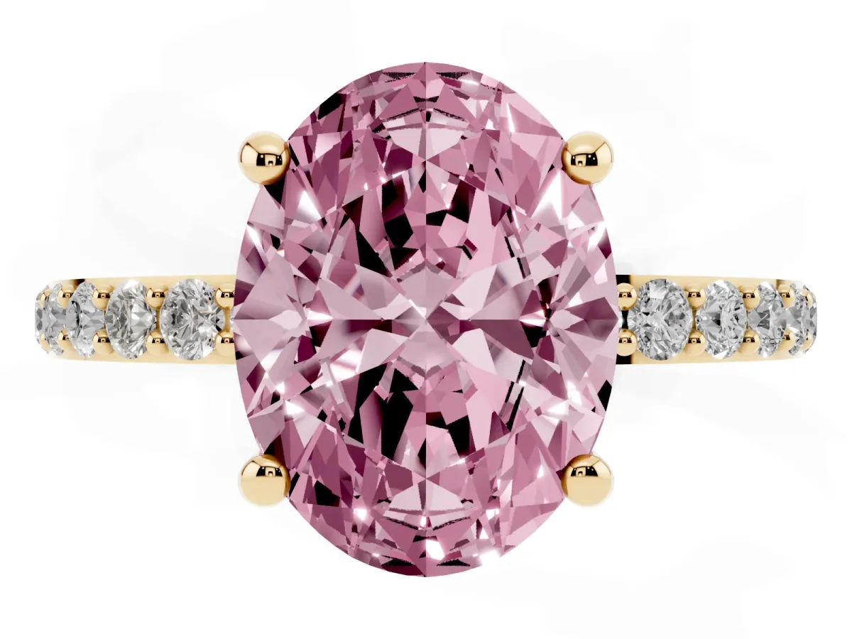 Fancy Pink Oval Cut Diamond Solitaire Ring with Round Pavé Band and Prong Setting Yellow gold