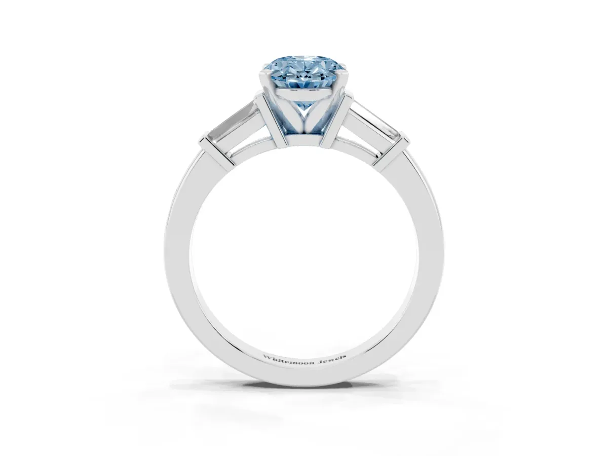 Fancy Blue Oval Cut Cut Diamond Solitaire Ring with Tapered Baguette Accents and Four-Prong Setting White gold