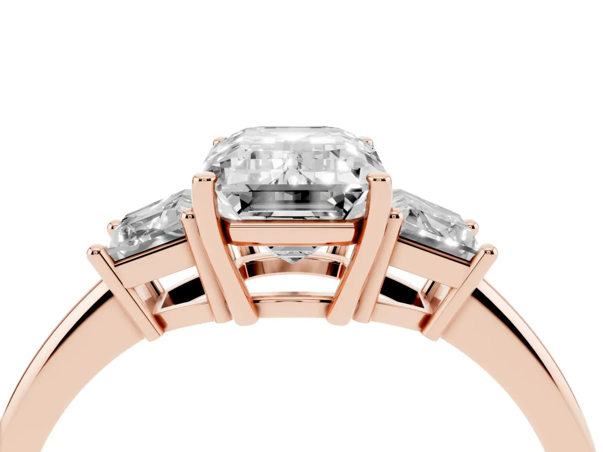 Emerald Cut Diamond Three-Stone Ring with Trapezoid Side Stones and Prong Setting Rose gold