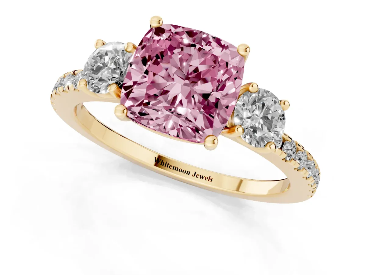 Fancy Pink Three-Stone Cushion Cut Cut Diamond Pavé Band with Prong Setting Yellow gold
