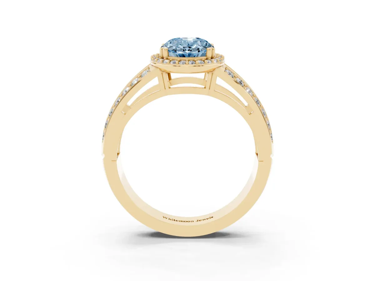 Fancy Blue Oval Cut Diamond Halo Ring with Split Shank Pavé Band and Four-Prong Setting Yellow gold