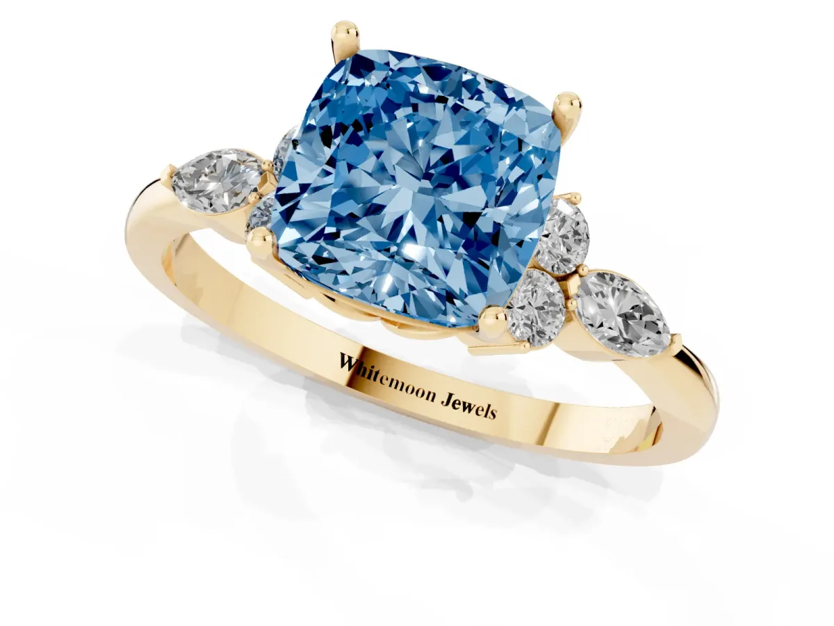 Fancy Blue Cushion Cut Brilliant Diamond Solitaire Ring with Pear Side Stones and Four-Prong Setting Yellow gold