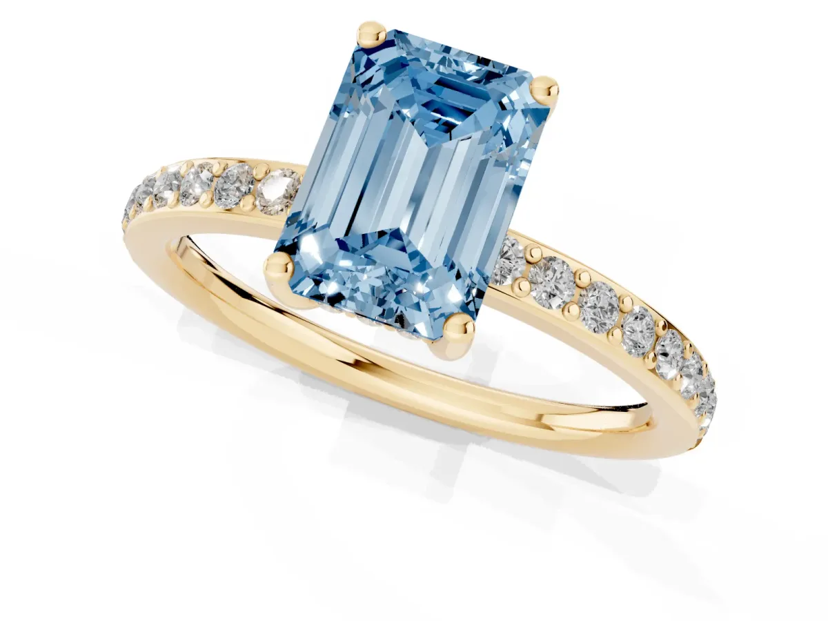 Fancy Blue Emerald Cut Cut Diamond Pavé Band Ring with Four-Prong Setting Yellow gold