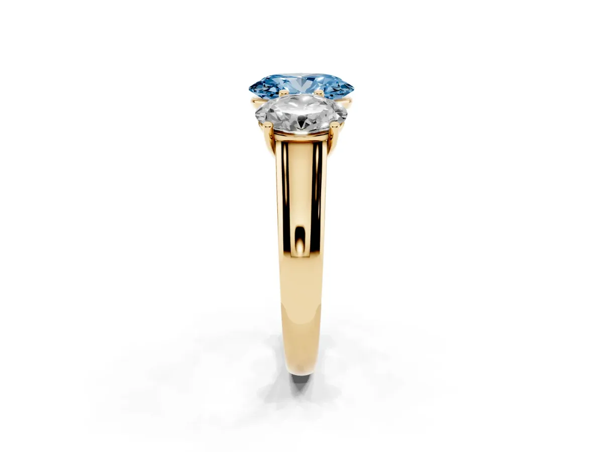 Fancy Blue Oval Cut Three-Stone Diamond Ring with Prong Setting on a Classic Band Yellow gold