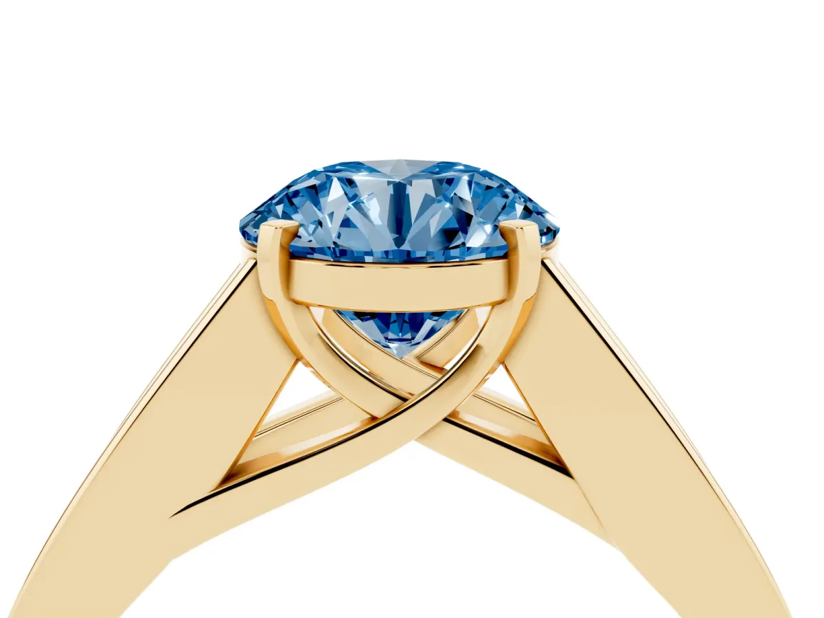 Fancy Blue Round Cut Cut Channel Set Solitaire Ring with Four-Prong Setting Yellow gold