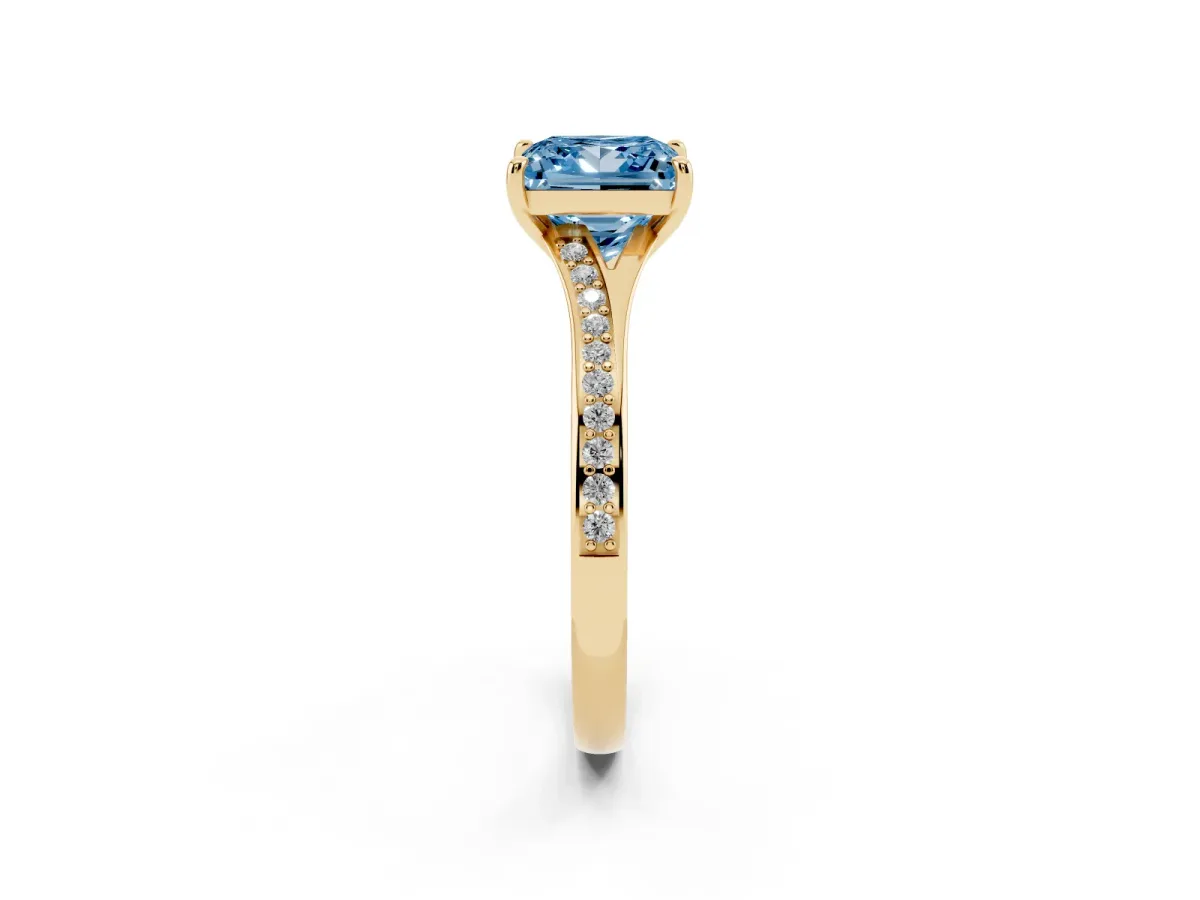 Fancy Blue Princess Cut Diamond Solitaire Ring with Pavé Band and Prong Setting Yellow gold