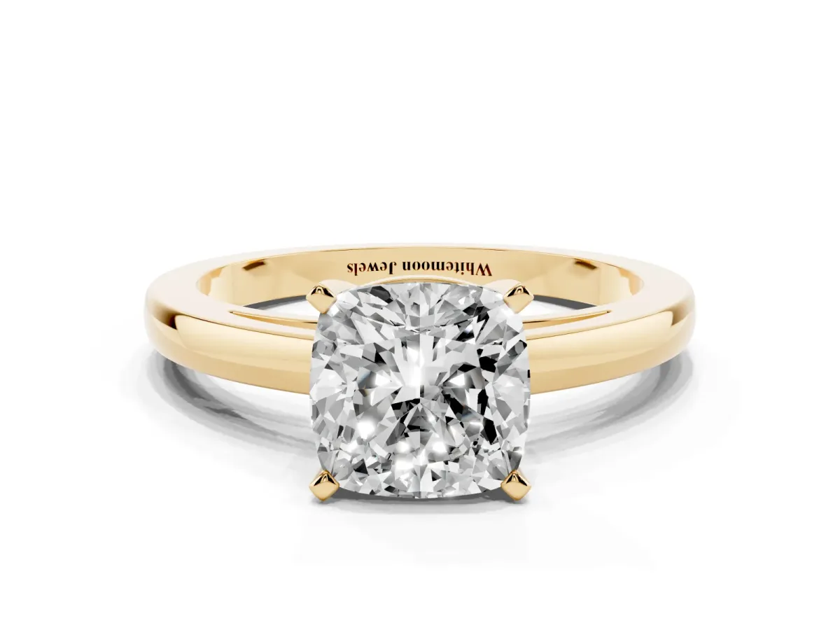 Cushion Cut Solitaire Diamond Engagement Ring with Four-Prong Setting on a Classic Band Yellow gold
