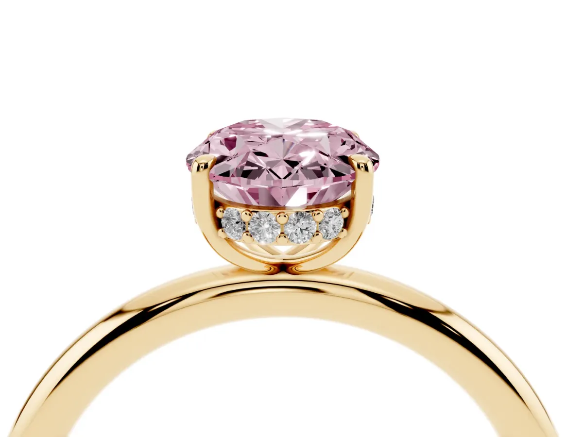 Fancy Pink Oval Cut Diamond Solitaire Ring with Thin Band and Four-Prong Setting Yellow gold