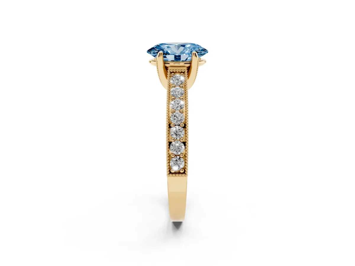 Fancy Blue Oval Cut Cut Diamond Solitaire Ring with Milgrain Pave Band and Four Prong Setting Yellow gold