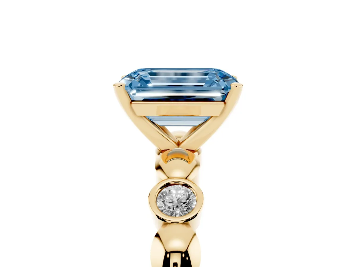 Fancy Blue Emerald Cut Solitaire Bezel-Set Diamond Ring with Beaded Band and Four-Prong Setting Yellow gold