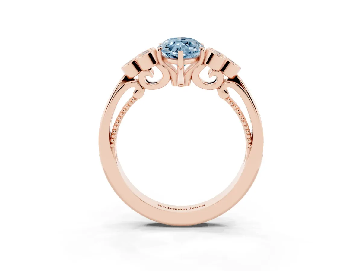Fancy Blue Marquise Cut Cut Diamond Engagement Ring with Bezel Set Round Side Stones and Prong Setting Rose gold