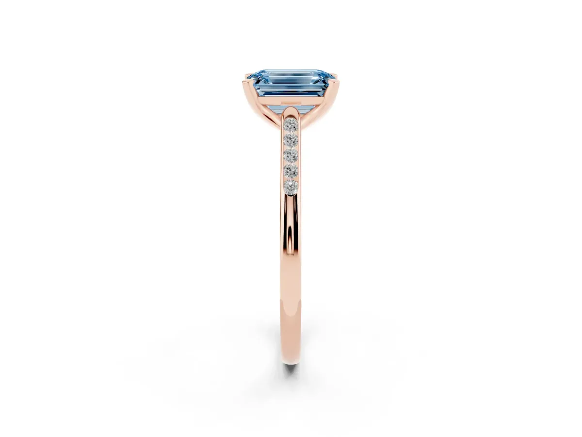 Fancy Blue Emerald Cut Diamond Solitaire Ring with Channel Set Round Band and Prong Setting Rose gold