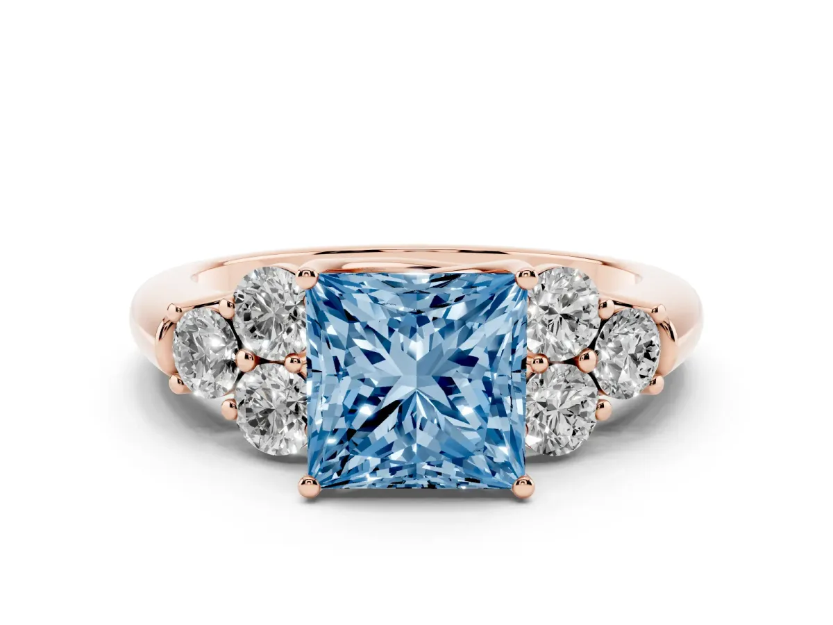 Fancy Blue Princess Cut Cut Diamond Cluster Ring with Round Accent Stones and Prong Setting on a Classic Band Rose gold