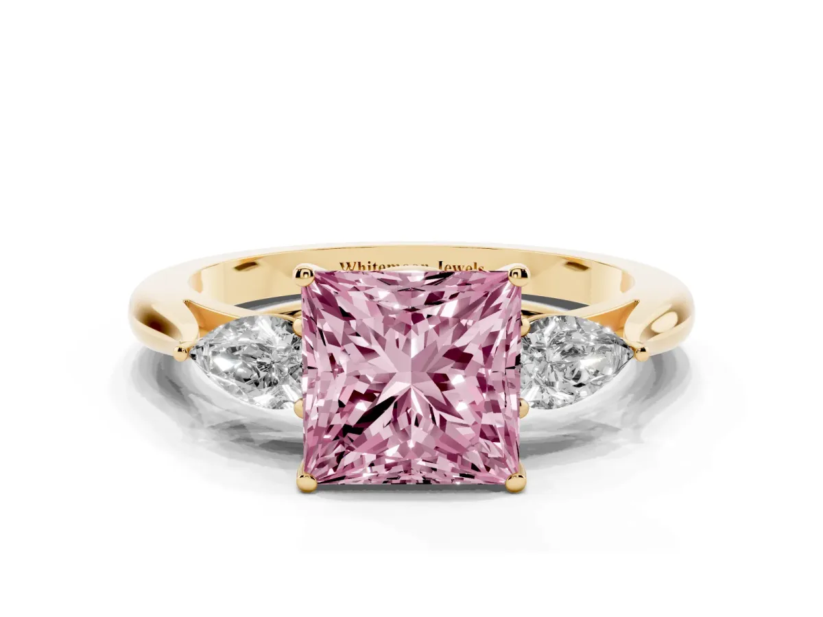 Fancy Pink Three-Stone Princess Cut Diamond Ring with Pear Side Stones in Four-Prong Setting Yellow gold