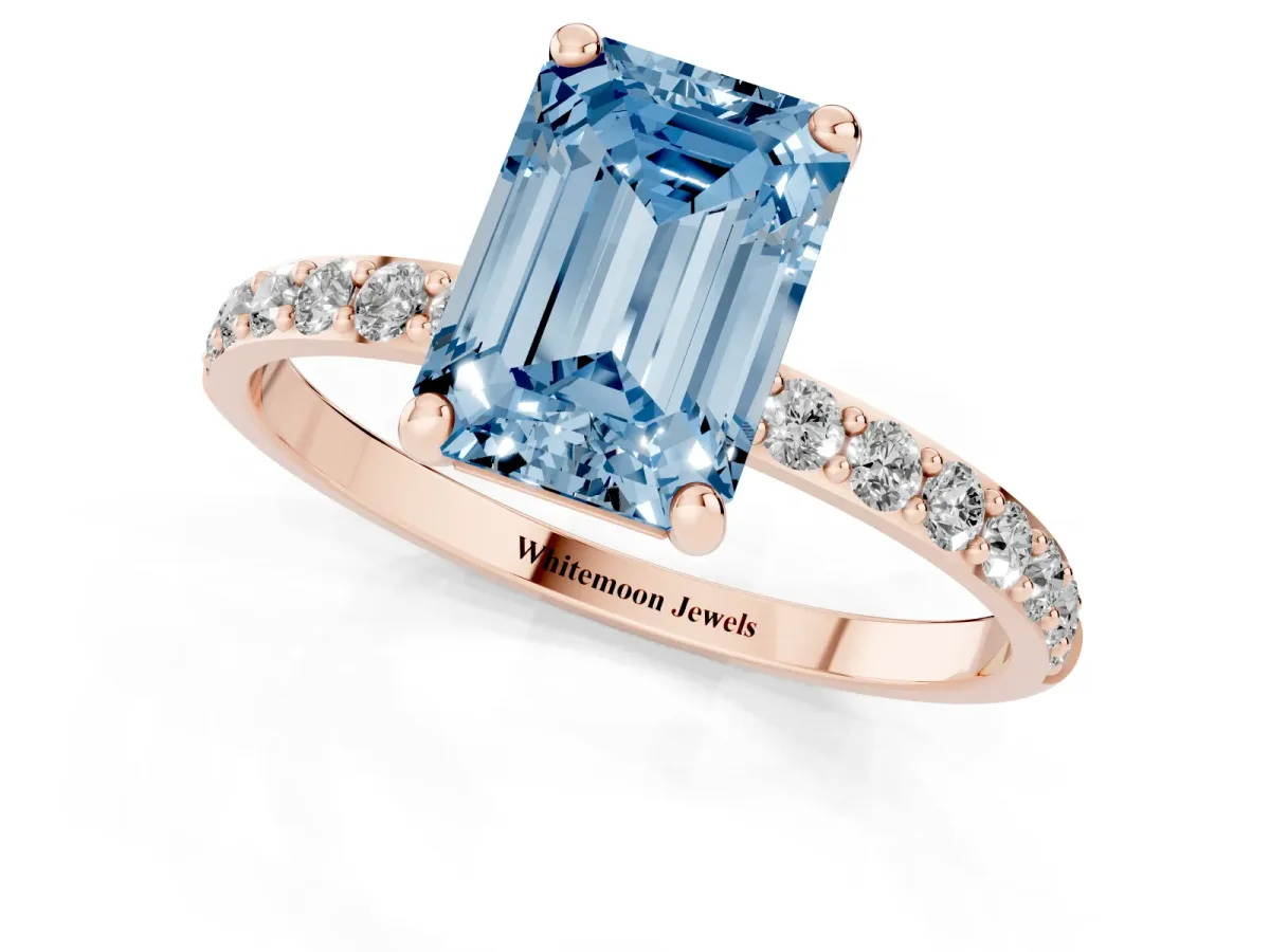 Fancy Blue Emerald Cut Diamond Solitaire Ring with Round Pavé Band and Prong Setting Rose gold