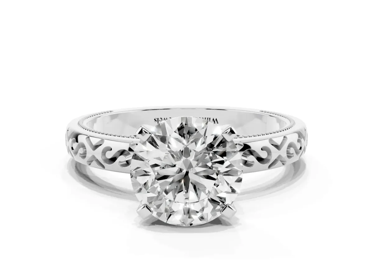 Round Cut Solitaire Engagement Ring with Scrollwork Band and Four-Prong Setting Silver