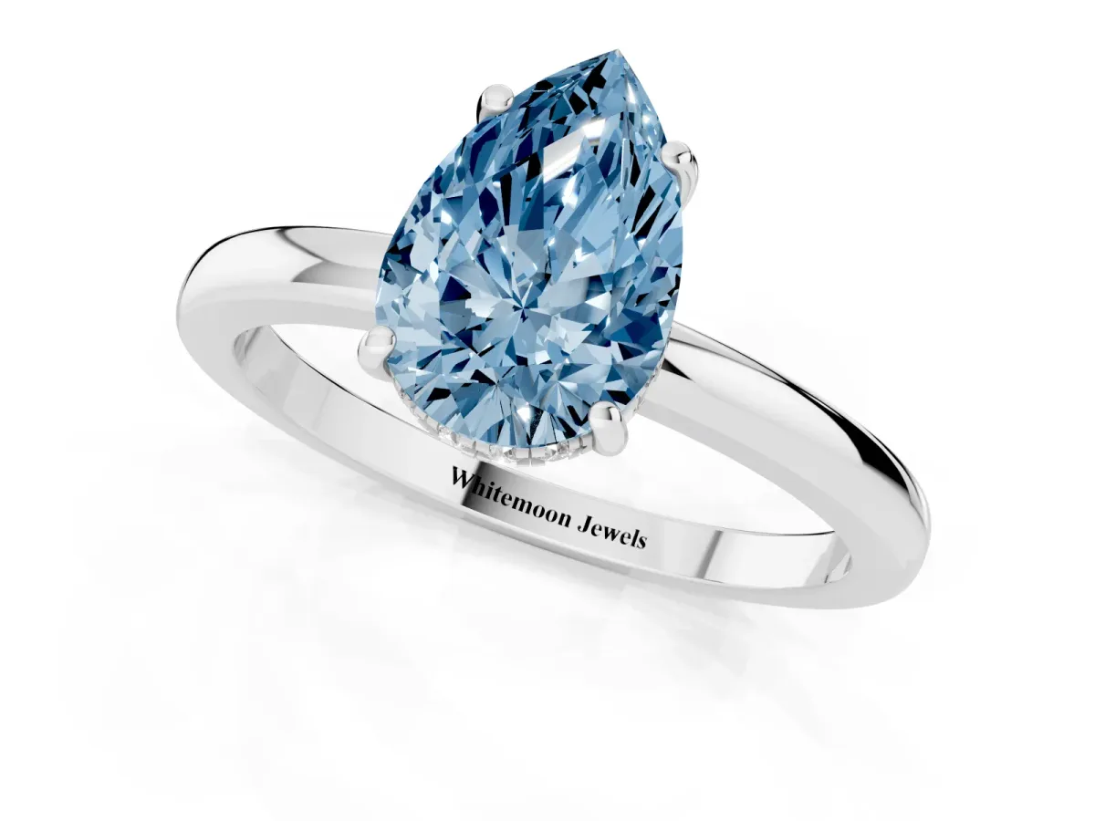 Fancy Blue Pear Cut Solitaire Diamond Ring with Prong Setting and Plain Band Platinum