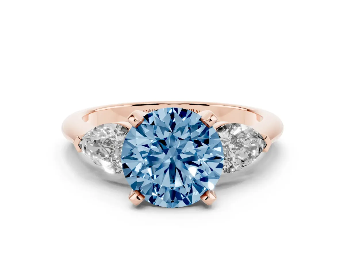 Fancy Blue Three-Stone Round Cut Diamond Ring with Pear Side Stones and Four-Prong Setting Rose gold