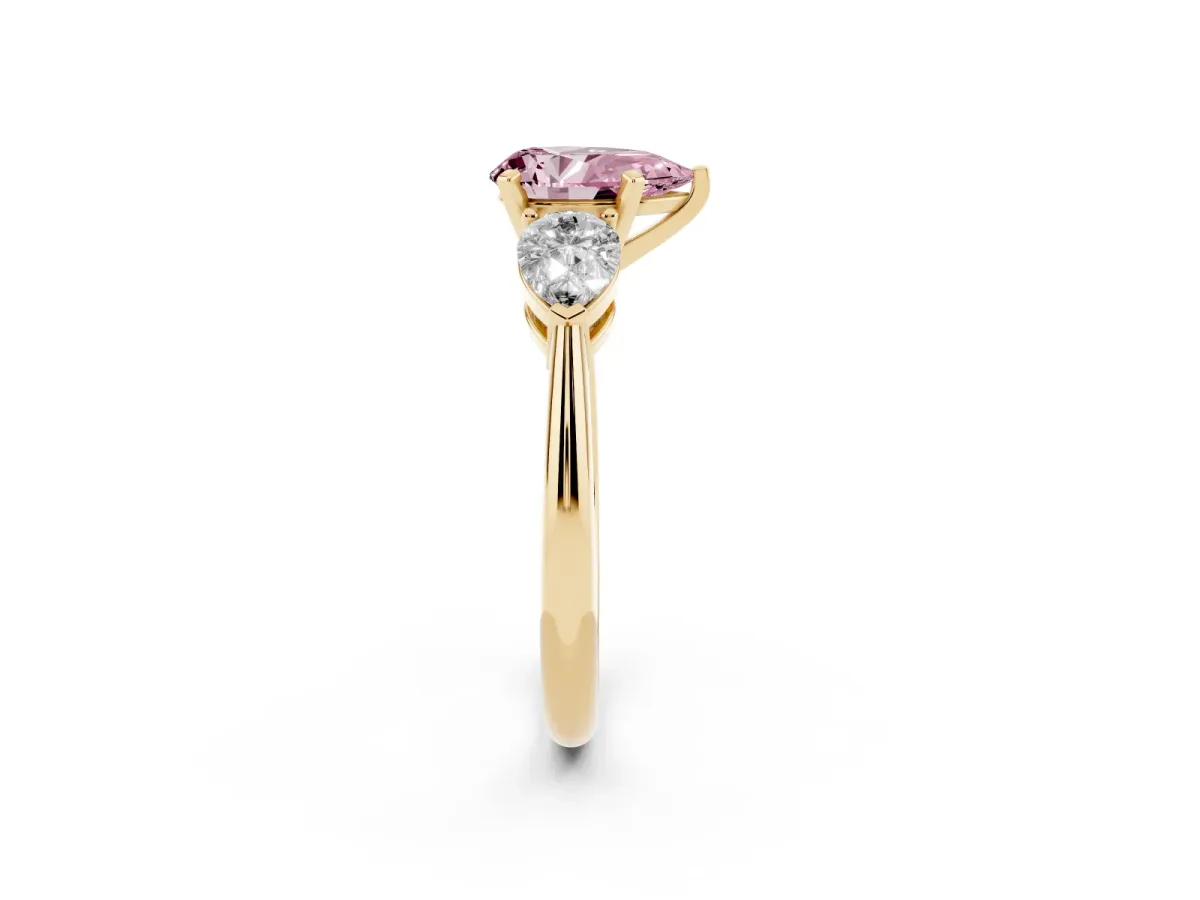 Fancy Pink Three-Stone Pear Cut Diamond Ring with Pear Side Stones and Four-Prong Setting Yellow gold