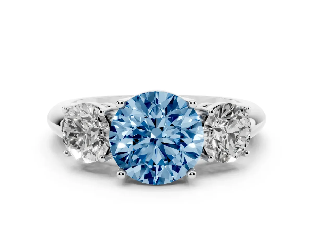 Fancy Blue Three-Stone Round Cut Cut Diamond Engagement Ring with Prong Setting on a White Gold Band Platinum
