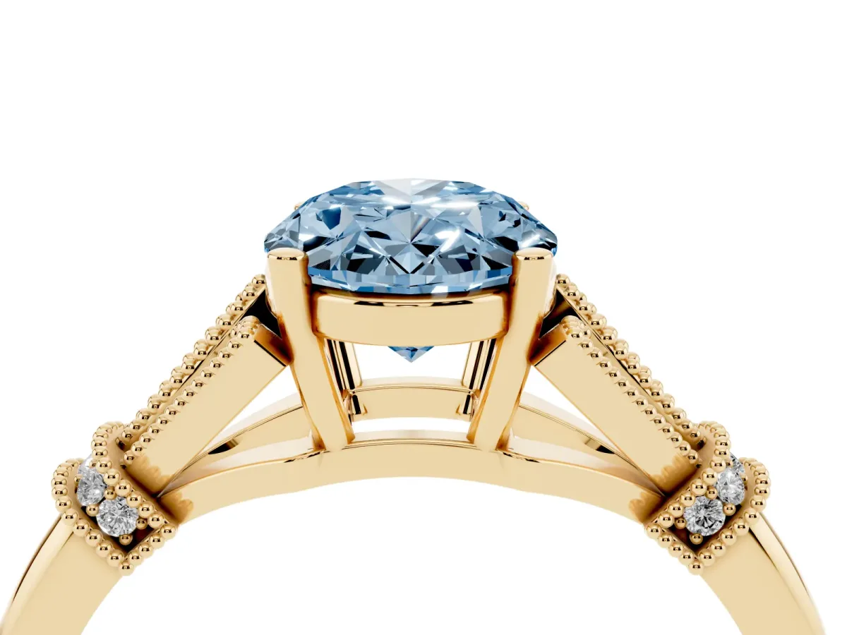 Fancy Blue Oval Cut Diamond Solitaire Ring with Floral Filigree and Pave Accents Yellow gold