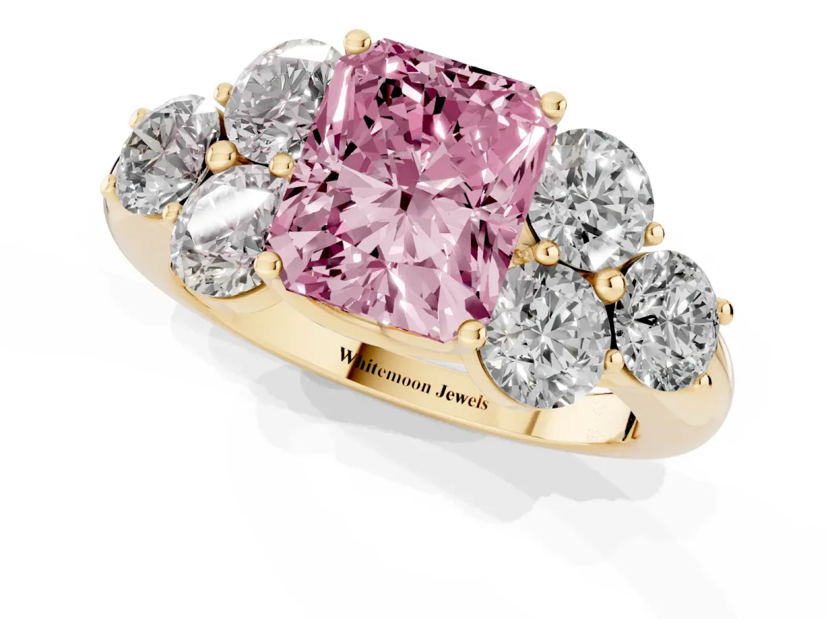 Fancy Pink Radiant Cut Cut Diamond Cluster Ring with Round Accent Stones and Prong Setting on a Classic Band Yellow gold