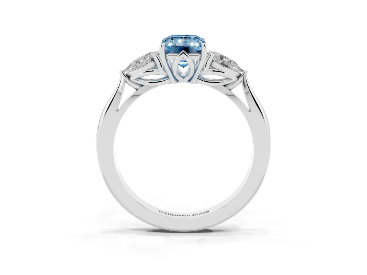 Fancy Blue Emerald Cut Diamond Three-Stone Ring with Pear Side Stones and Prong Setting Platinum