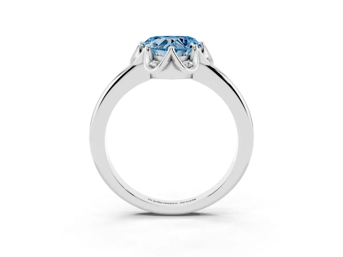 Fancy Blue Heart Cut Halo Diamond Ring with Round Cluster Setting, Solitaire Band, and Four-Prong Setting Platinum