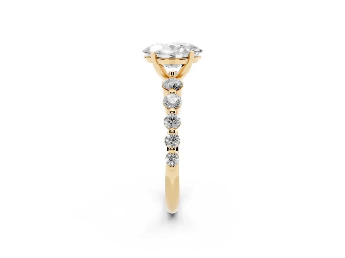 Oval Cut Solitaire Diamond Ring with Pave Band and Four-Prong Setting Yellow gold