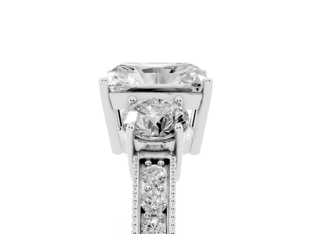 Radiant Cut Three-Stone Diamond Ring with Pavé Band and Four-Prong Setting Platinum