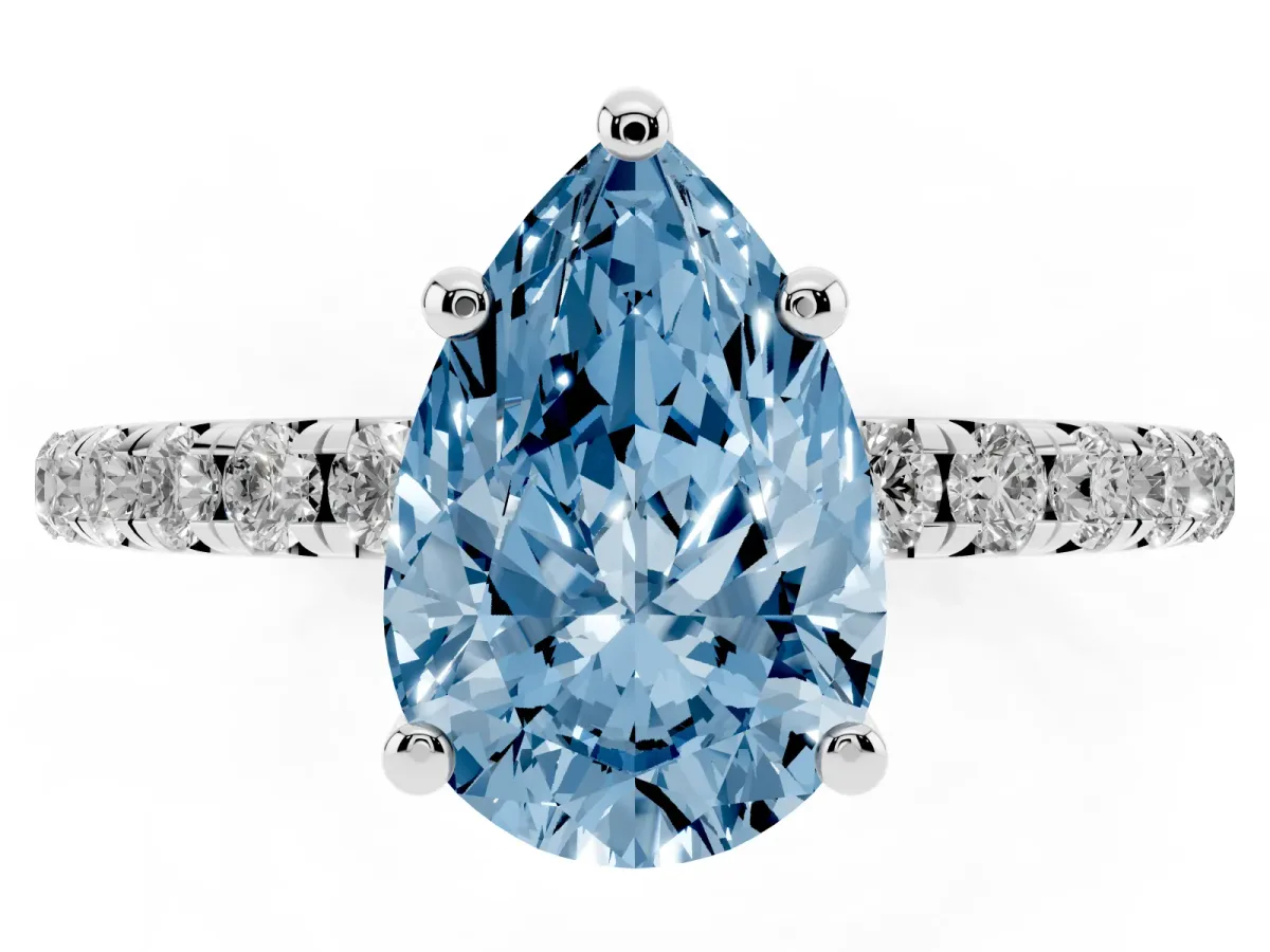 Fancy Blue Pear Cut Cut Diamond Solitaire Ring with Micro Pave Band and Four Prong Setting Silver