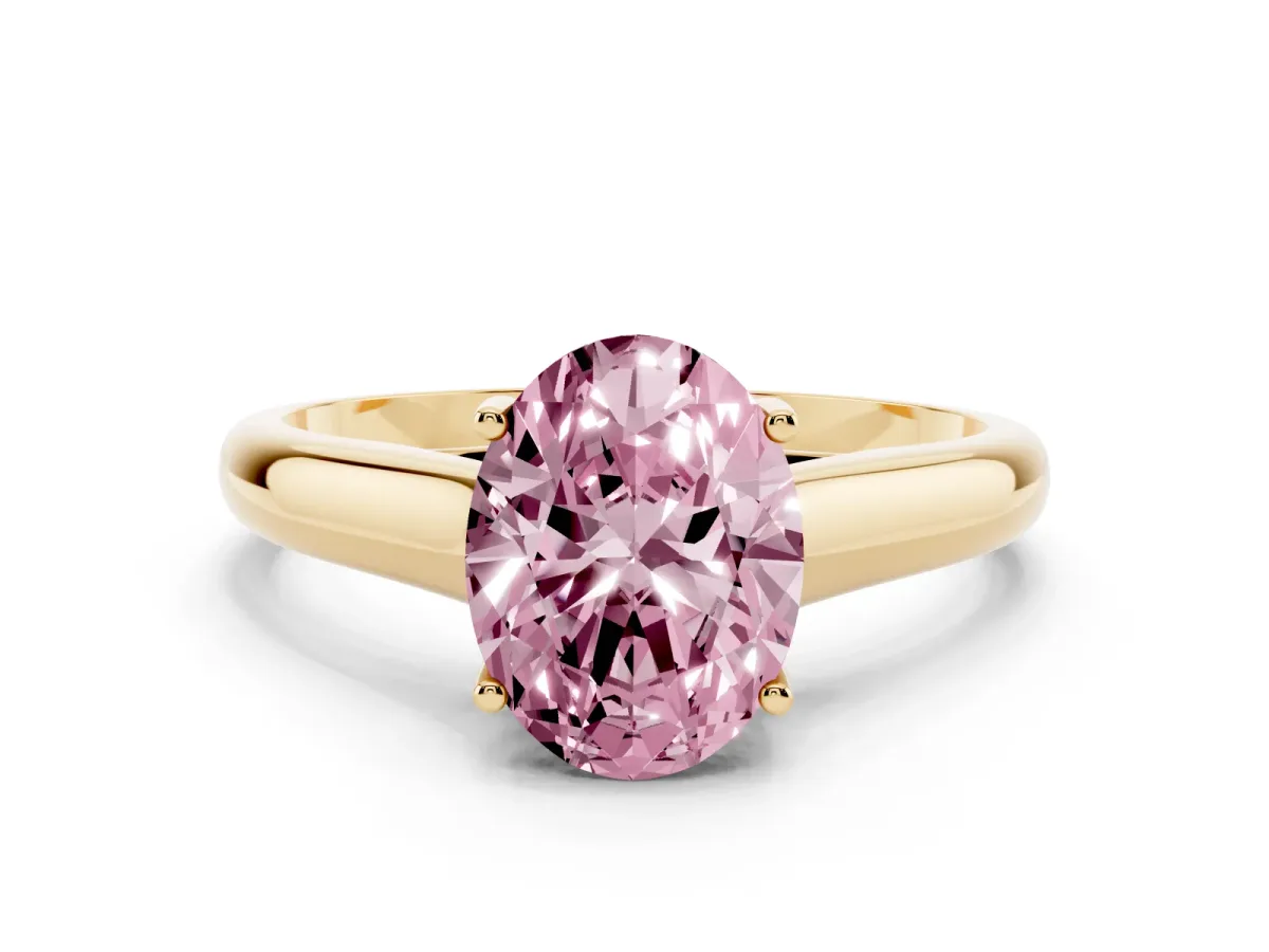 Fancy Pink Oval Cut Solitaire Engagement Ring with Tapered Band and Four-Prong Setting Yellow gold