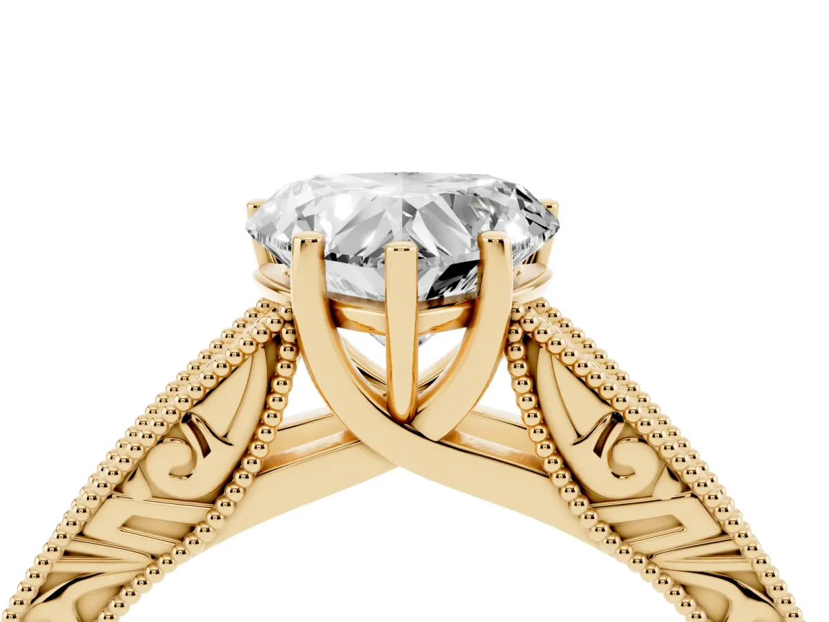 Heart Cut Diamond Solitaire Ring with Engraved Band and Four-Prong Setting Yellow gold