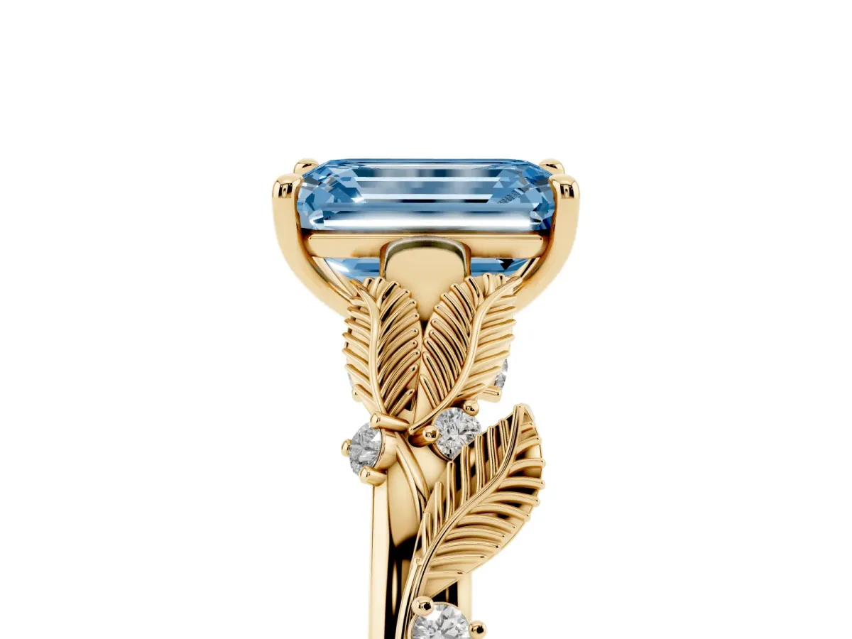 Fancy Blue Emerald Cut Diamond Solitaire Ring with Leaf Motif Band and Four-Prong Setting Yellow gold