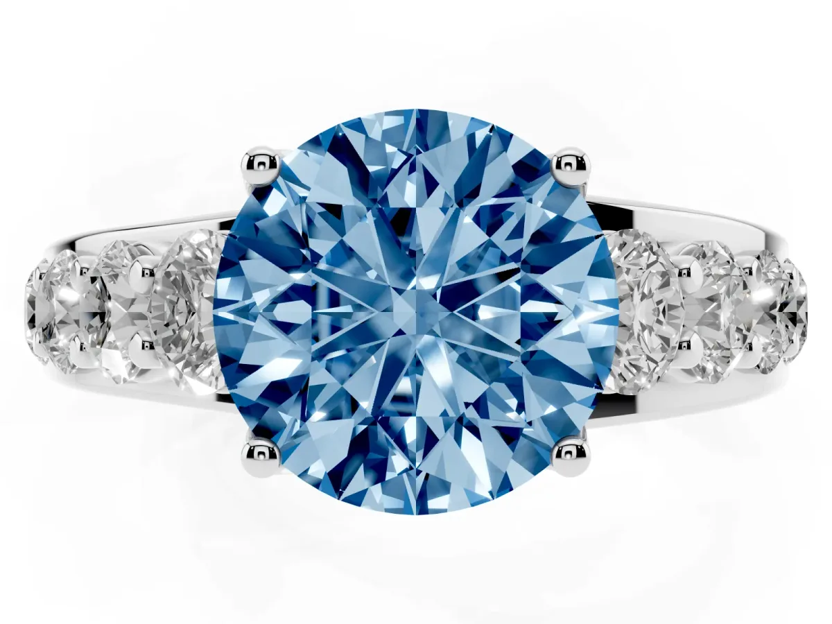 Fancy Blue Round Cut Diamond Engagement Ring with Pavé Band and Four-Prong Setting Silver