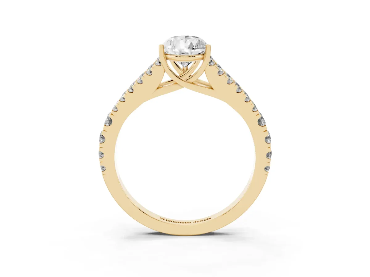Pear Cut Diamond Split Shank Engagement Ring with Round Pavé and Prong Setting Yellow gold