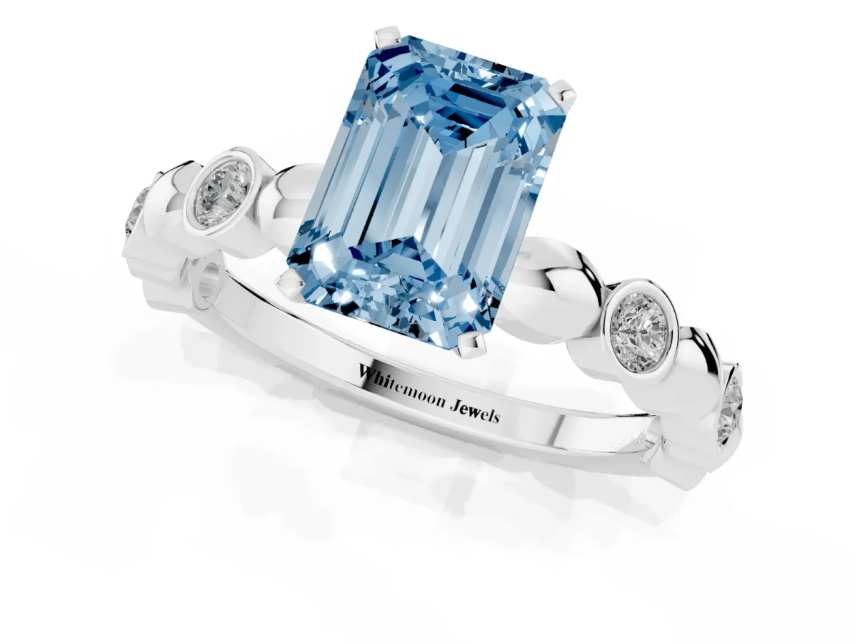 Fancy Blue Emerald Cut Solitaire Bezel-Set Diamond Ring with Beaded Band and Four-Prong Setting Silver