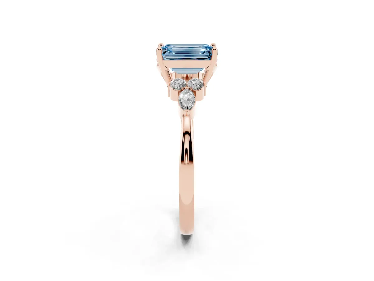 Fancy Blue Emerald Cut Brilliant Diamond Solitaire Ring with Pear Side Stones and Four-Prong Setting Rose gold