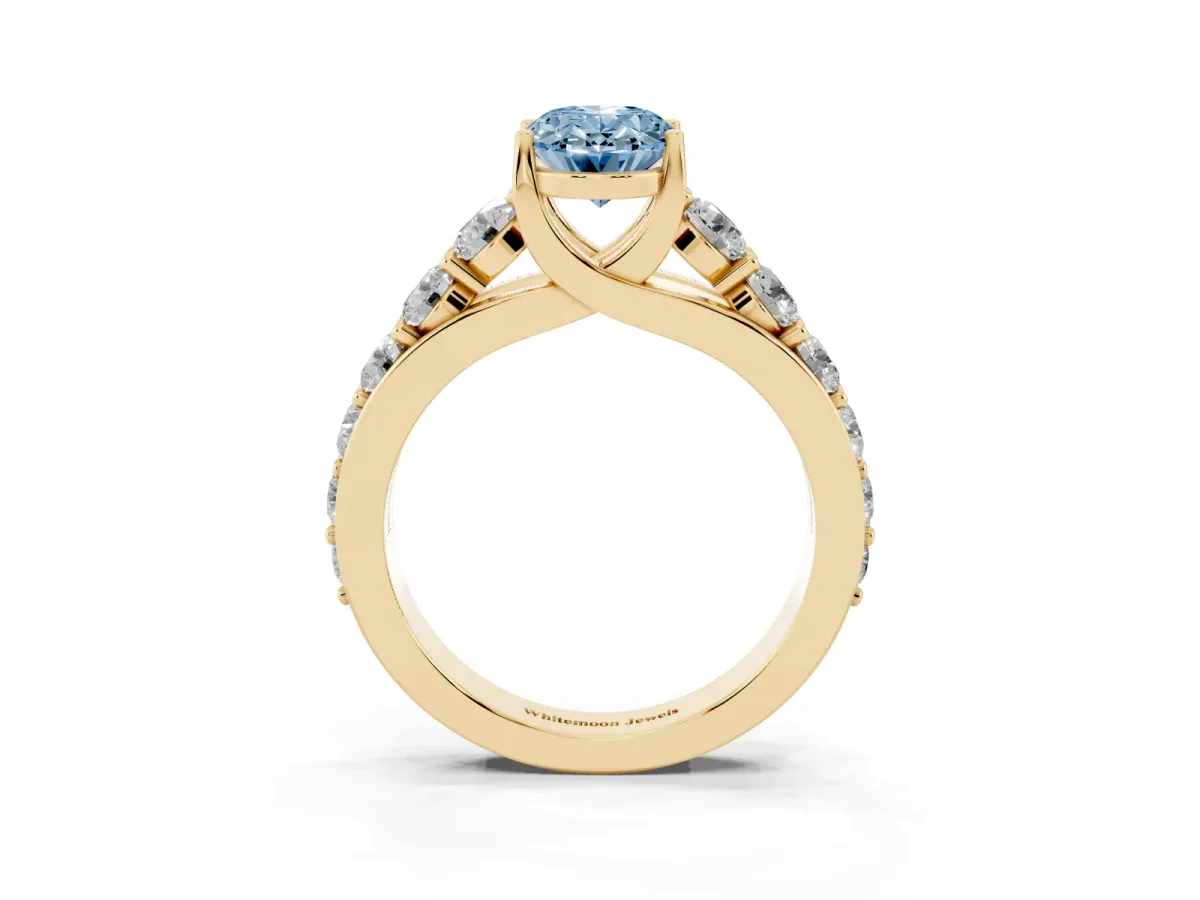 Fancy Blue Oval Cut Diamond Engagement Ring with Pavé Band and Four-Prong Setting Yellow gold