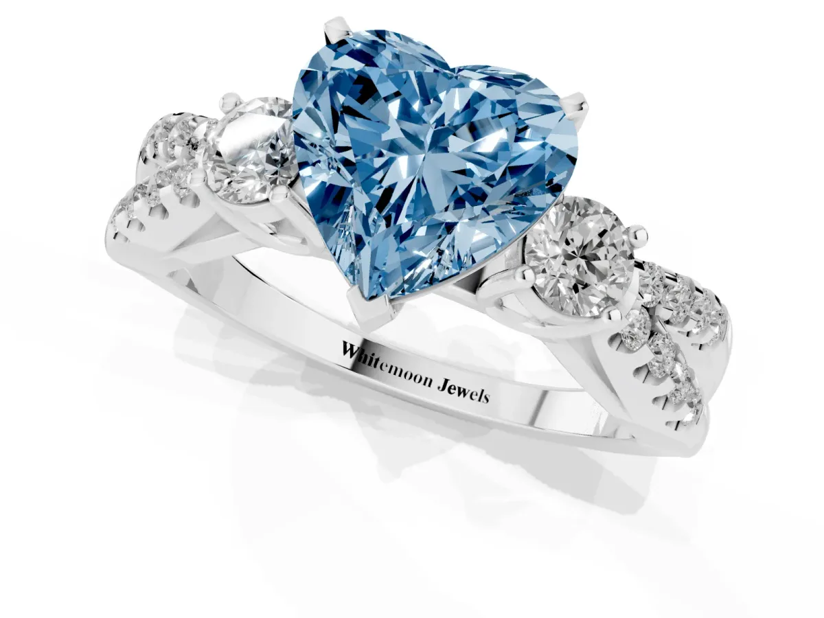 Fancy Blue Heart Cut Diamond Three-Stone Ring with Pavé Split Shank and Four-Prong Setting Silver