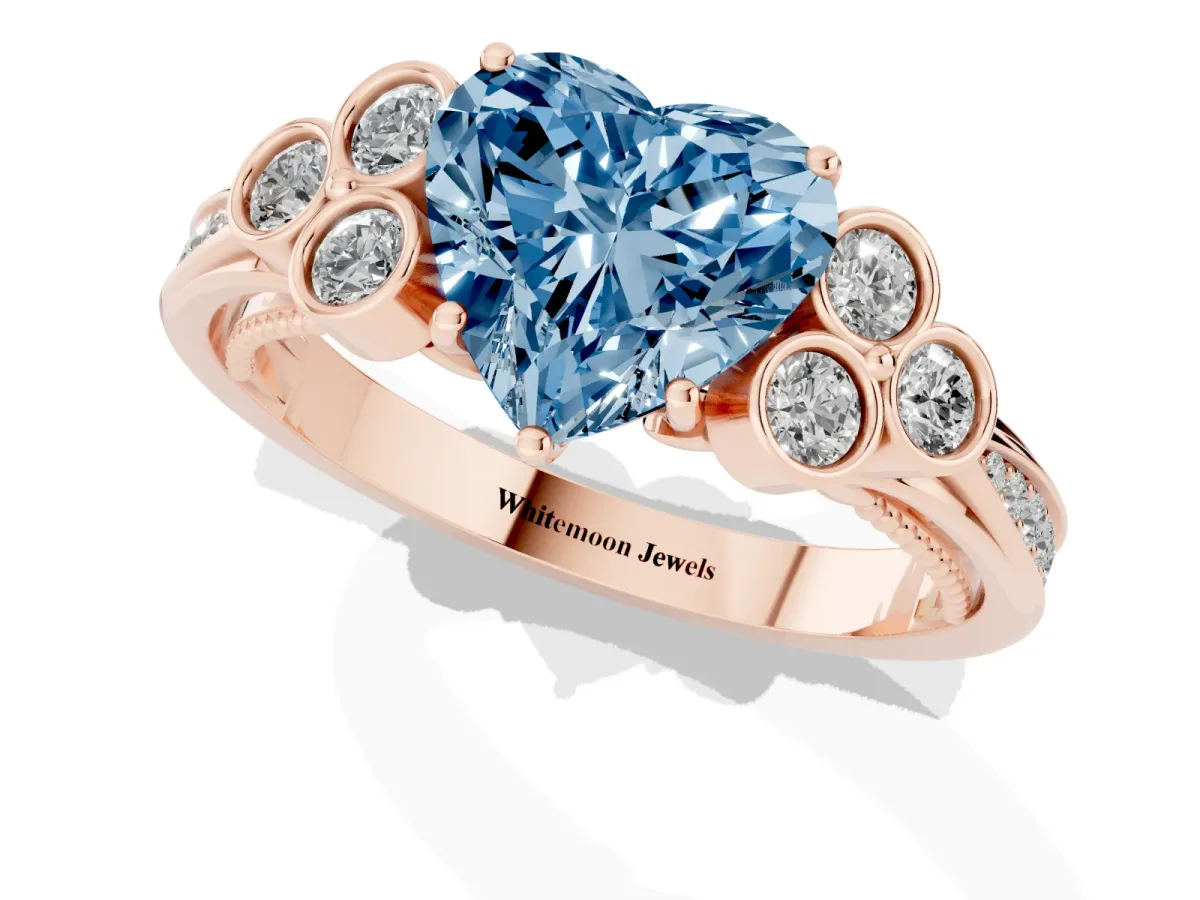 Fancy Blue Heart Cut Cut Diamond Engagement Ring with Bezel Set Round Side Stones and Prong Setting Rose gold
