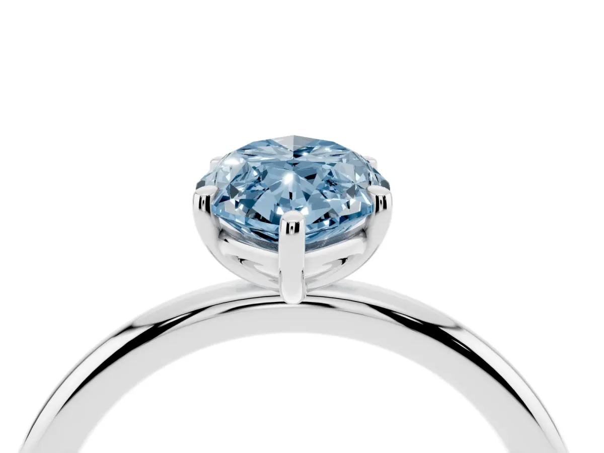Fancy Blue Marquise Cut Solitaire Diamond Ring with Four-Prong Setting on a Plain Band Silver