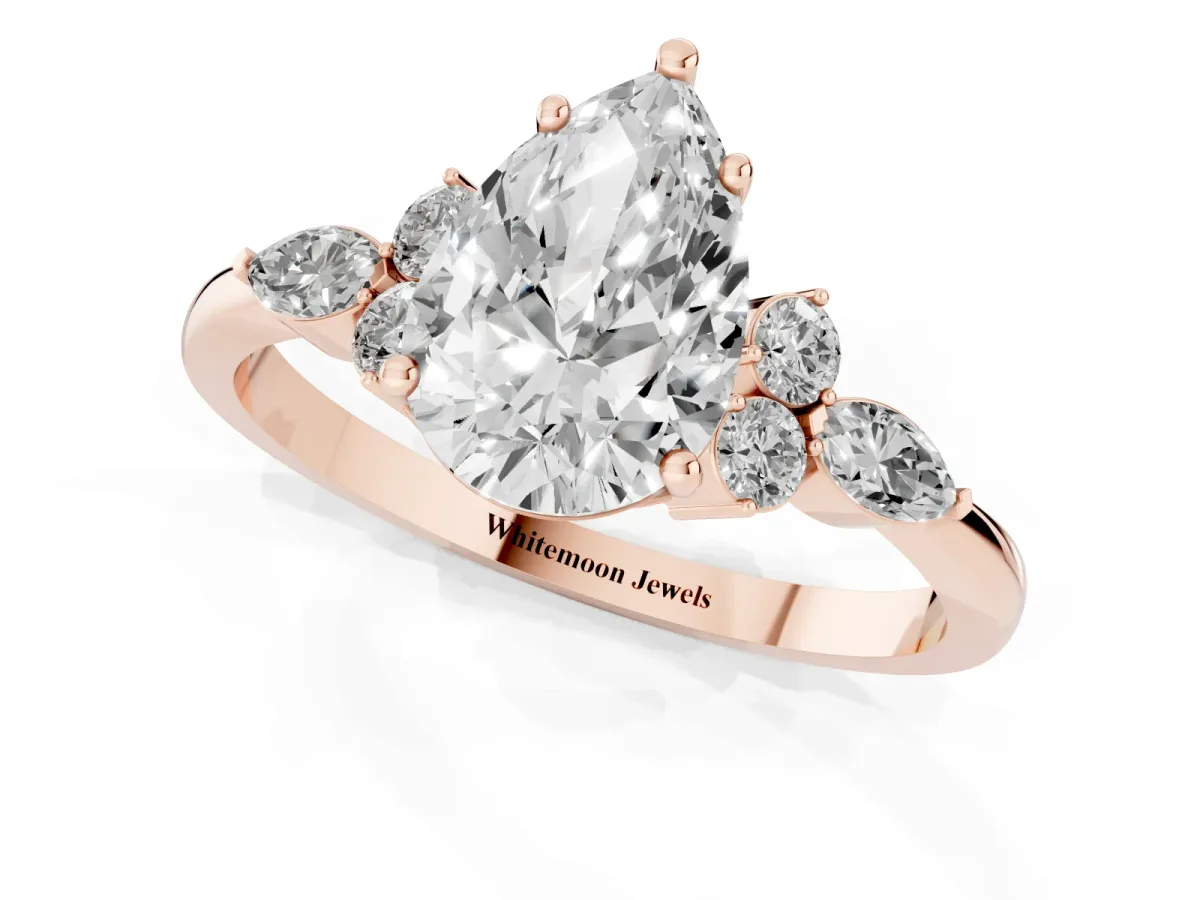 Pear Cut Brilliant Diamond Solitaire Ring with Pear Side Stones and Four-Prong Setting Rose gold