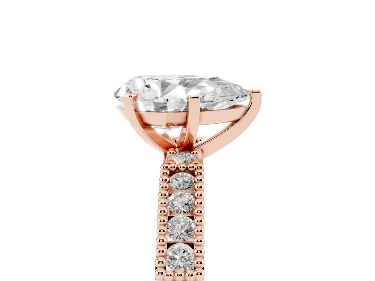 Pear Cut Solitaire with Pavé Band and Four-Prong Setting Rose gold